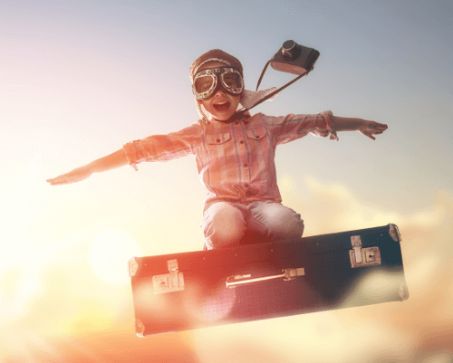 Child pretending to fly through the air