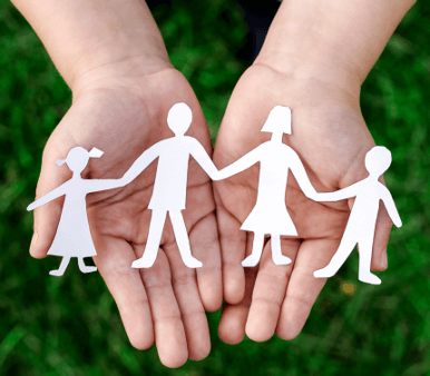 a paper chain of people, joined in hands
